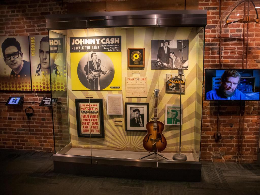 Belongings of Johnny Cash displayed in a glass case in the museum in Nashville