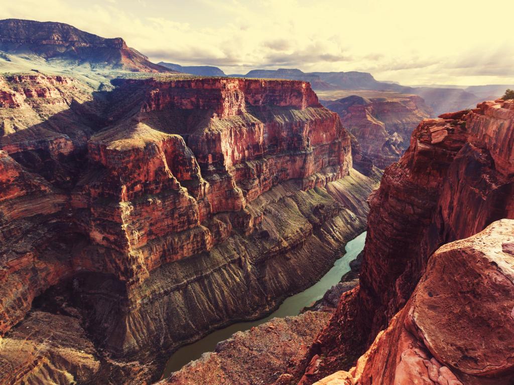 Grand Canyon National Park, USA with the picturesque landscapes of canyons and the river below, taken just before sunset with a soft glow.