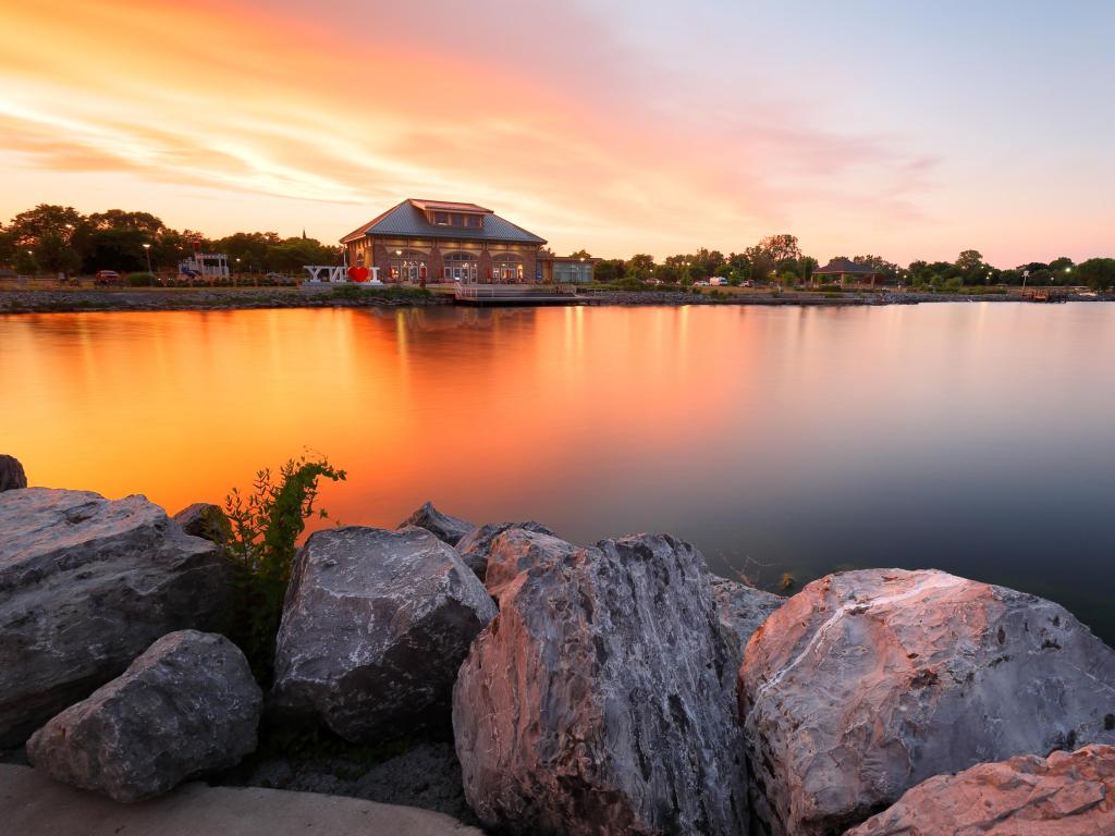 Geneva New York with a beautiful sunset of Seneca Lake and Finger Lakes Welcome Center in Finger Lakes region of upstate of New York, Geneva NY USA