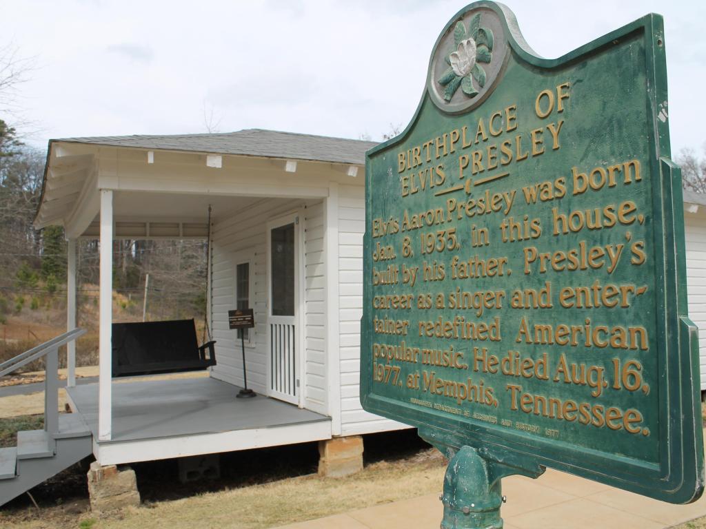 Elvis Presley's Birthplace in Tupelo, with a sign outside