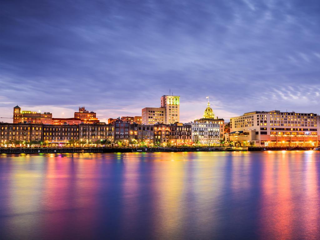 Savannah, Georgia, USA downtown skyline at the riverfront at dusk.