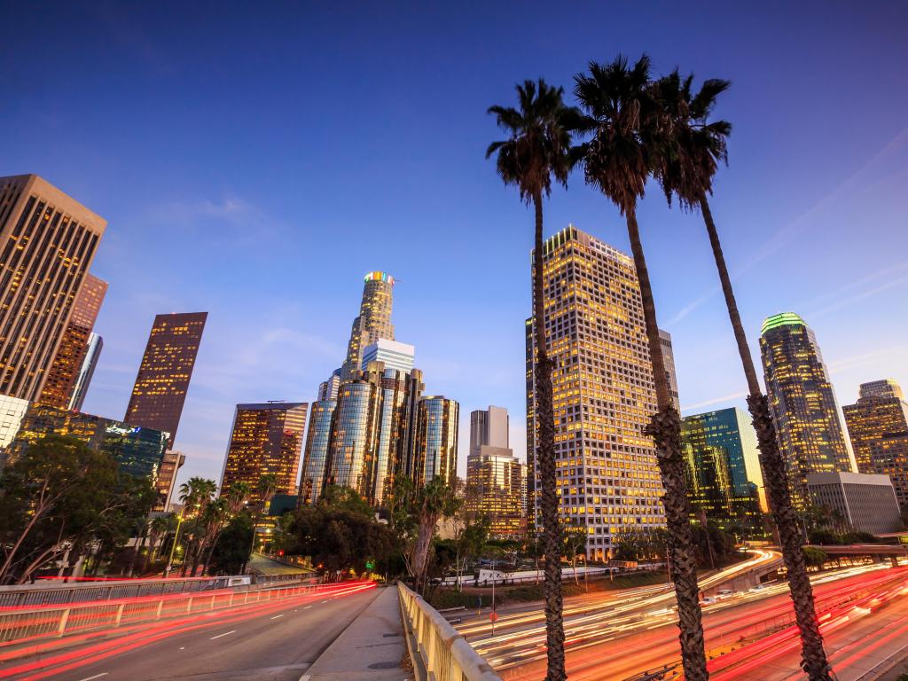 Downtown Los Angeles, California, USA skyline during rush hour at sunset.