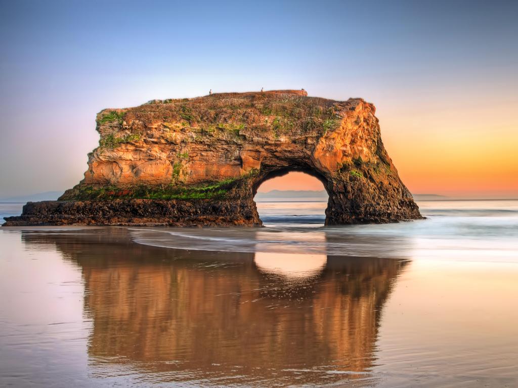 Santa Cruz, California, USA at the Natural Bridges State Beach at sunset.