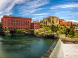 Panoramic view of the Washington Water Power building and Monroe Street Bridge by the Spokane River in Spokane, Washington