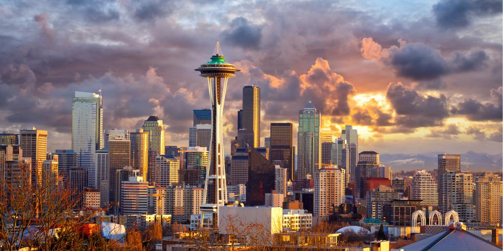 The futuristic Space Needle dominates the Seattle skyline on a cloudy day