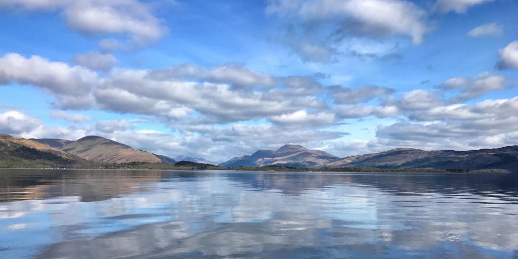 Reflections of the hills and clouds in Loch Lomond