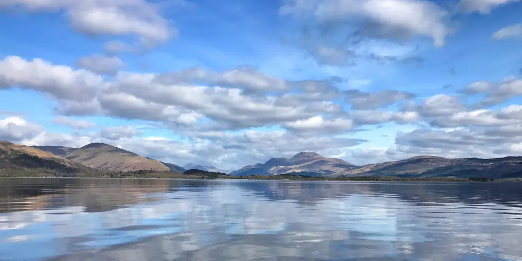 Reflections of the hills and clouds in Loch Lomond
