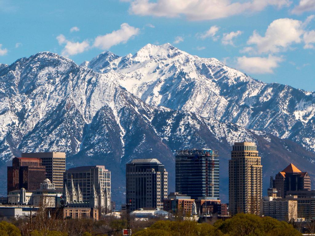 Salt Lake City panoramic view with snow-capped mountains in the background.