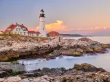 Portland Head Lighthouse at Cape Elizabeth, Maine, USA, during a pastel colored sunset