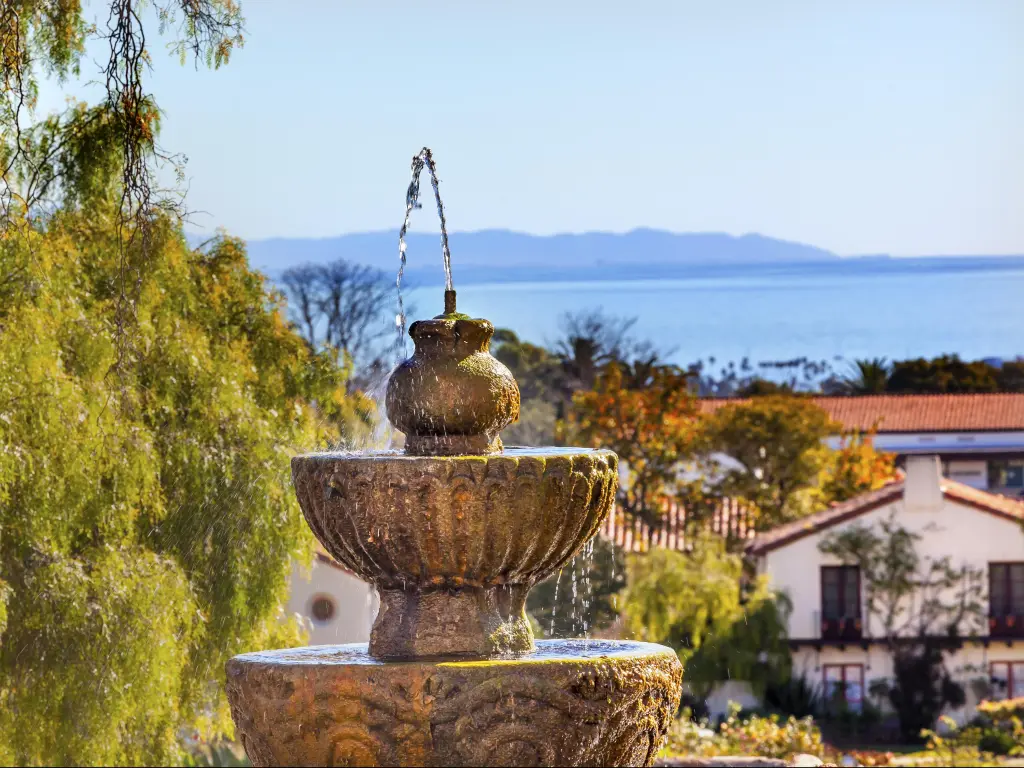 A fountain in front of traditional buildings in Santa Barbara, California