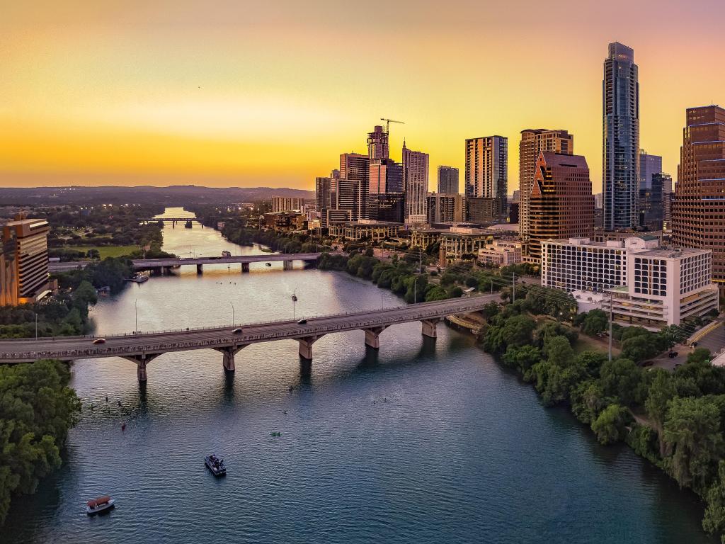 Austin Skyline at sunset over looking the bridge and river surrounded by sky scrapers in the background