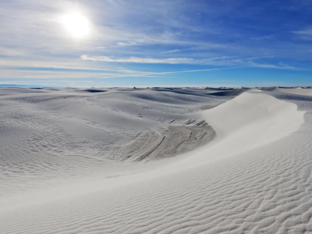 Alkali Flat Trail in White Sands National Monument, New Mexico, USA against a blue sky.