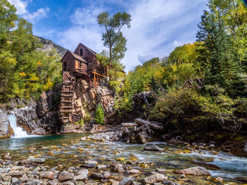 The historic Crystal Mill in the fall, as seen from the Crystal River on a sunny day, Colorado, USA.