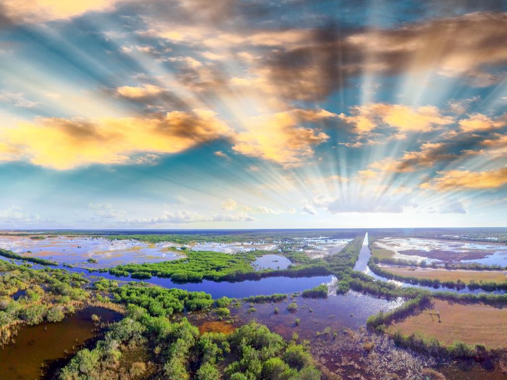 Aerial view of Everglades National Park, Florida, with stunning blue waters and lush green vegetation and sunset above