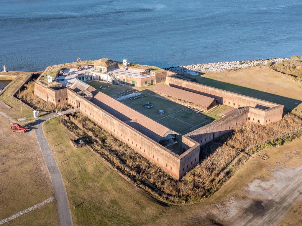 View of the fort  by the river from an aerial POV on a sunny day