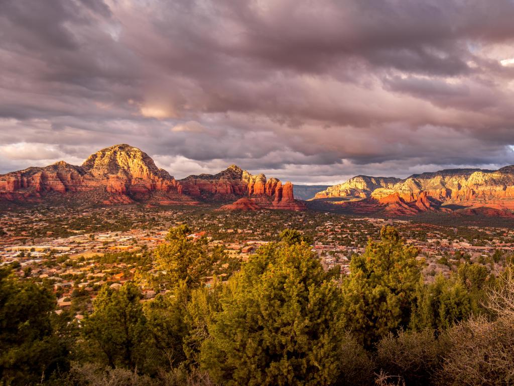 Coconino National Forest, Arizona, USA with a sunset over Thunder Mountain and other red rock mountains surrounding the town of Sedona in northern Arizona.