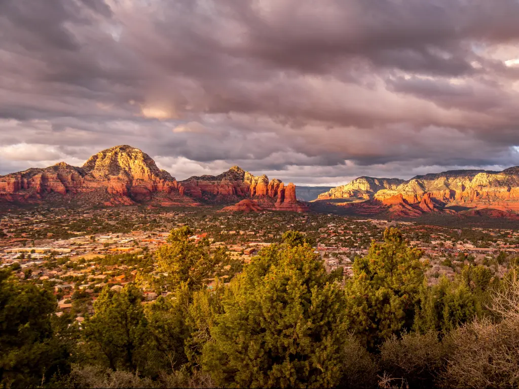Coconino National Forest, Arizona, USA with a sunset over Thunder Mountain and other red rock mountains surrounding the town of Sedona in northern Arizona.