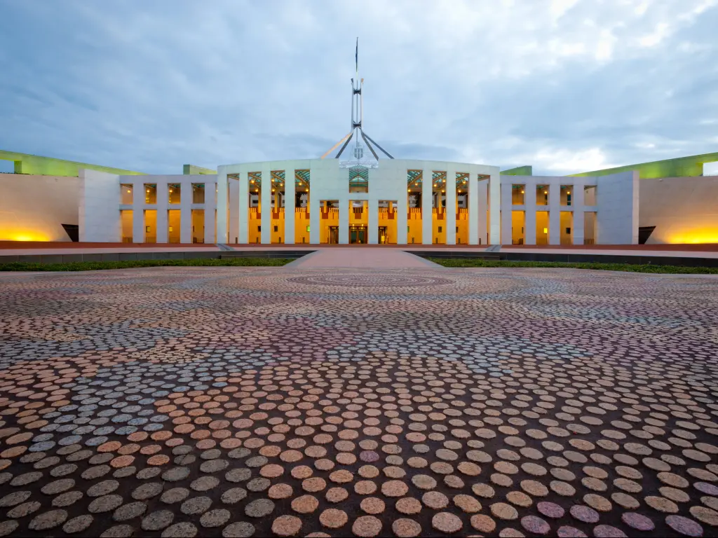 The new Australian Parliament House in Canberra at dusk.
