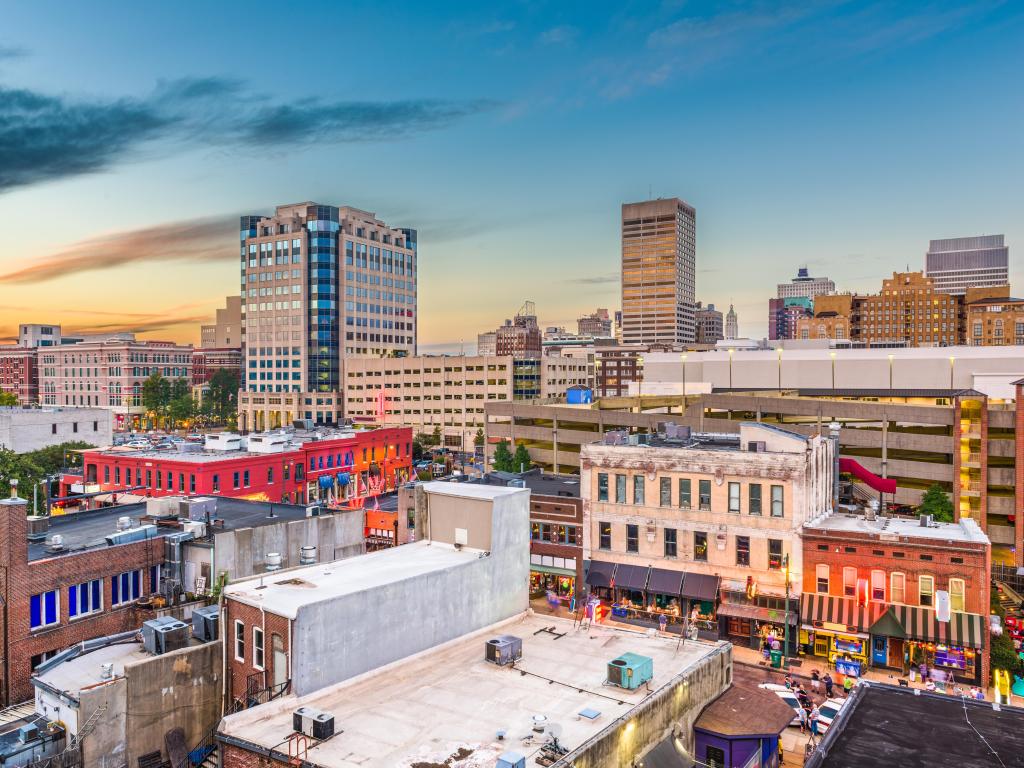 Memphis, Tennessee, USA with the downtown city skyline over Beale Street after sunset.