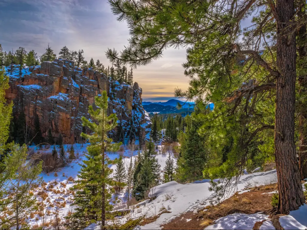 Snow lies on the ground on a winter's morning hike to Lion's Head and Elk Falls in Staunton State Park, Colorado