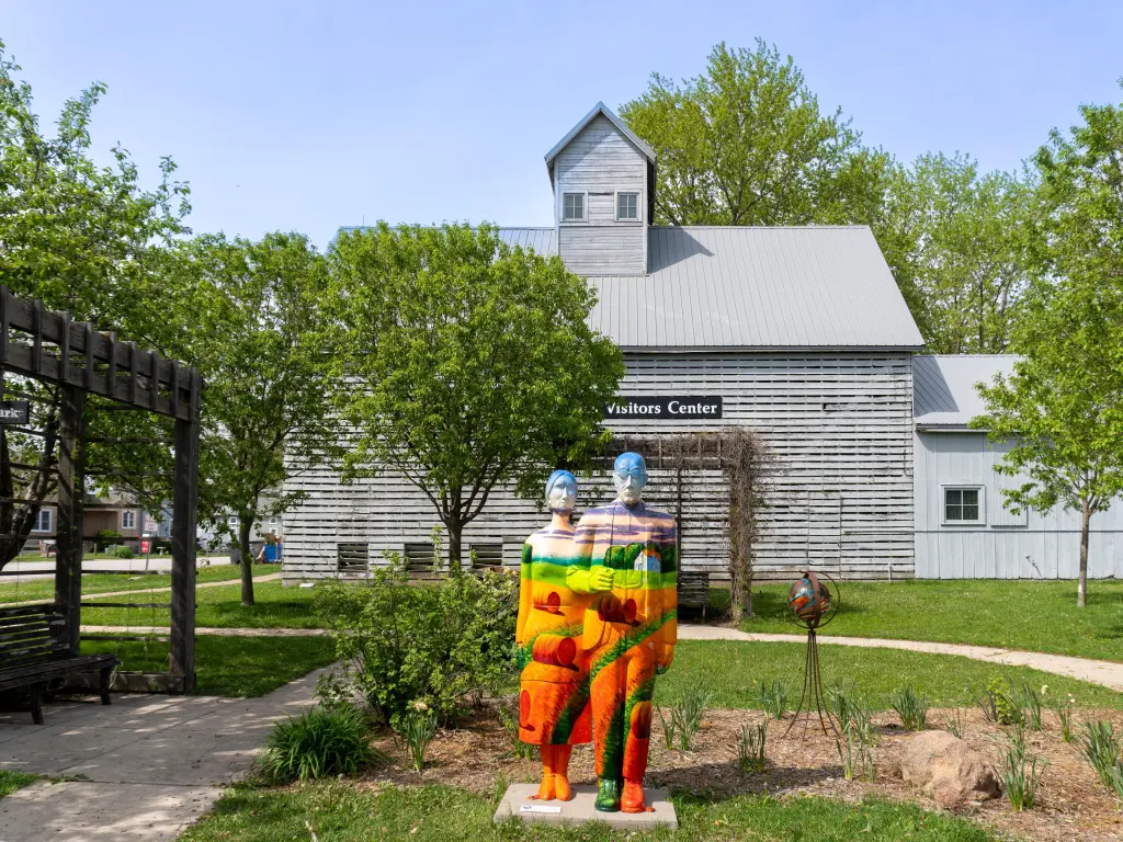 Colorful statue of German Pietists in front of the Amana Colonies Visitors Center in Iowa