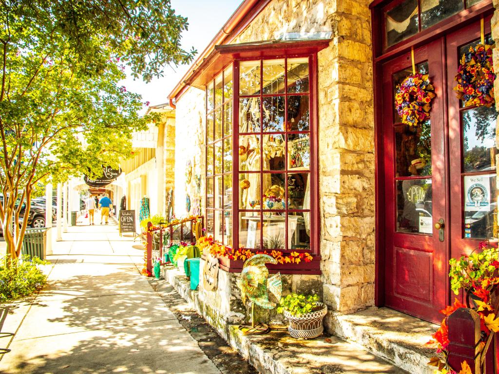 View of the Main Street in Frederiksburg, Texas, also known as The Magic Mile, with retail stores and people walking