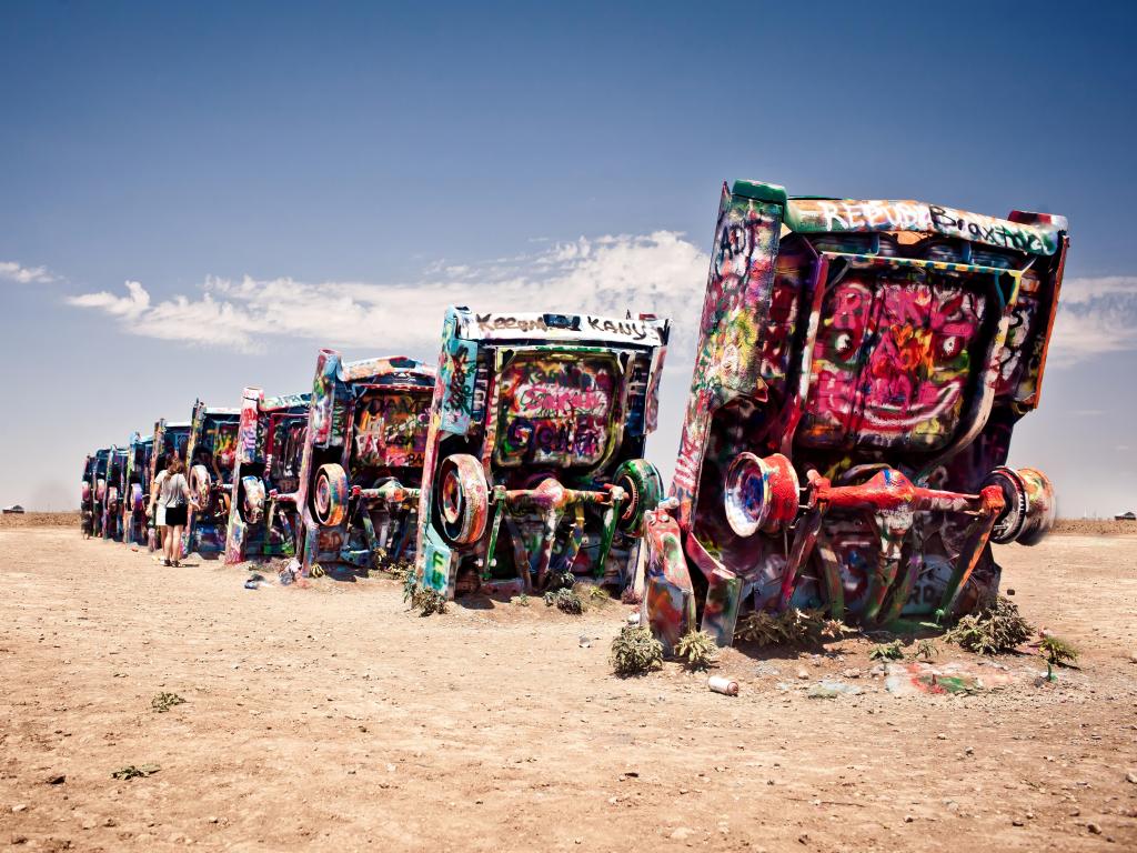 Famous art installation Cadillac Ranch on July 10,2011 near Amarillo, Texas. It was created in 1974 by C. Lord, H. Marquez and D. Michels and consist from 7 buried Cadillacs