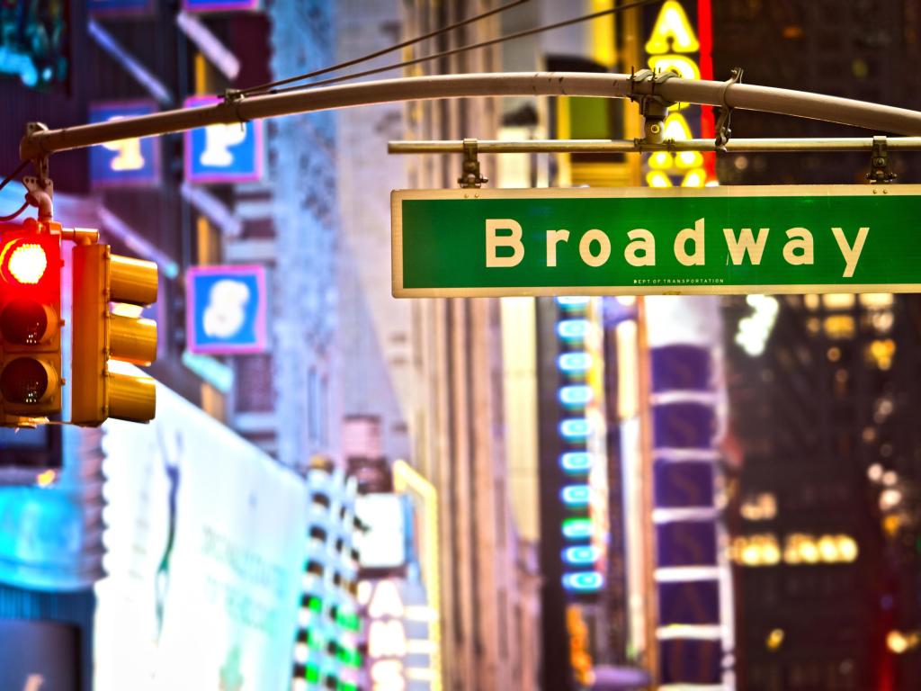 Broadway road sign and red stop light, New York