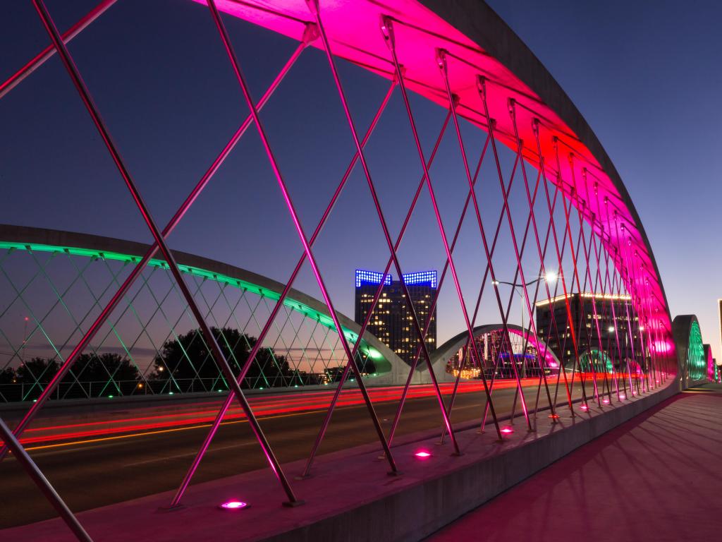 Fort Worth, Texas, USA taken at West 7th Street Bridge at night with neon colors on the bridge. 