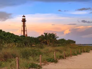 The Sanibel Island Lighthouse is framed against the late light from the setting sun, Sanibel Island, Florida, USA.