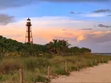 The Sanibel Island Lighthouse is framed against the late light from the setting sun, Sanibel Island, Florida, USA.