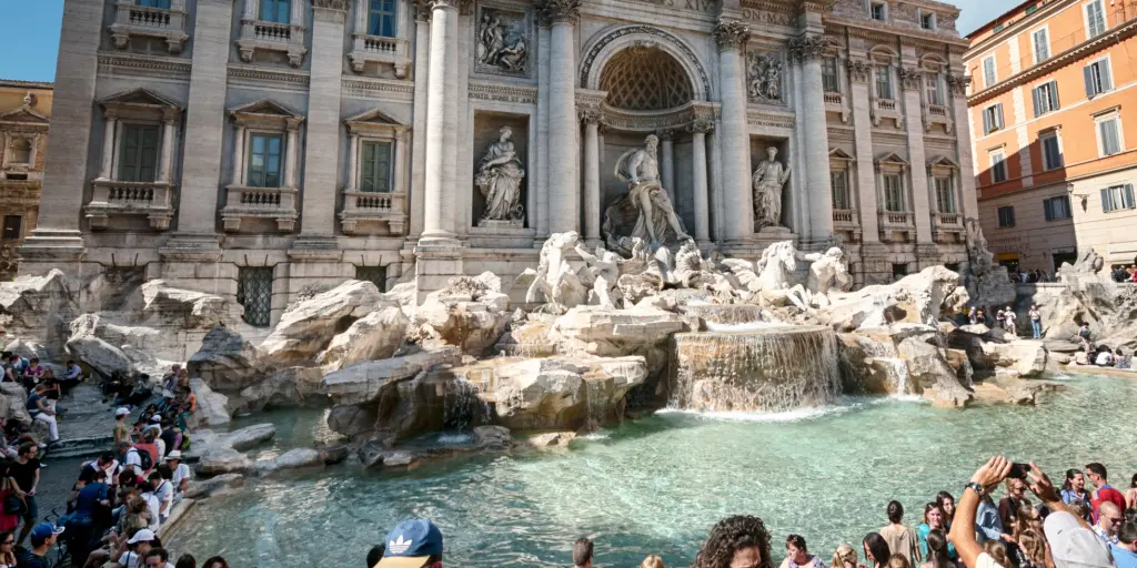 People enjoying the Trevi Fountain, Rome 