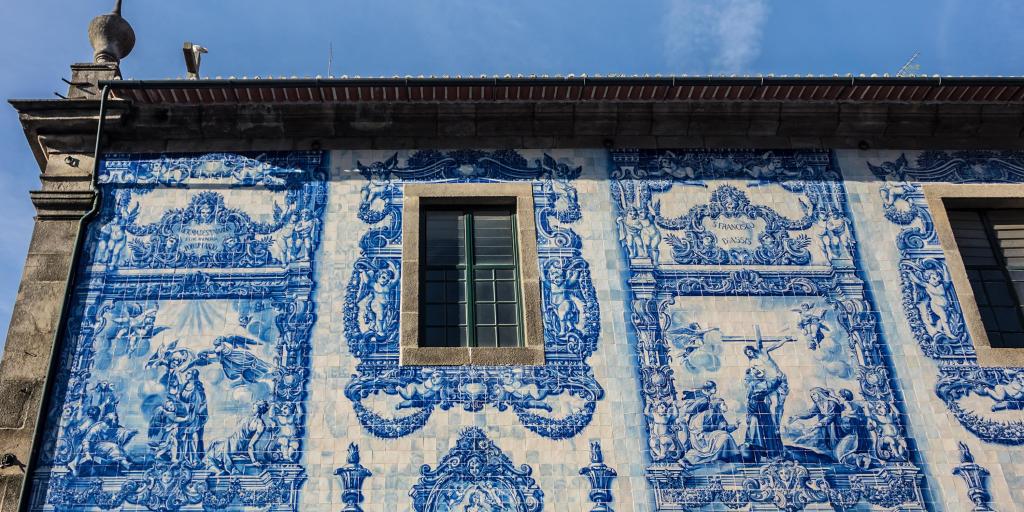 Distinctive blue and white tiles on the walls of Chapel of Souls in Porto, Portugal