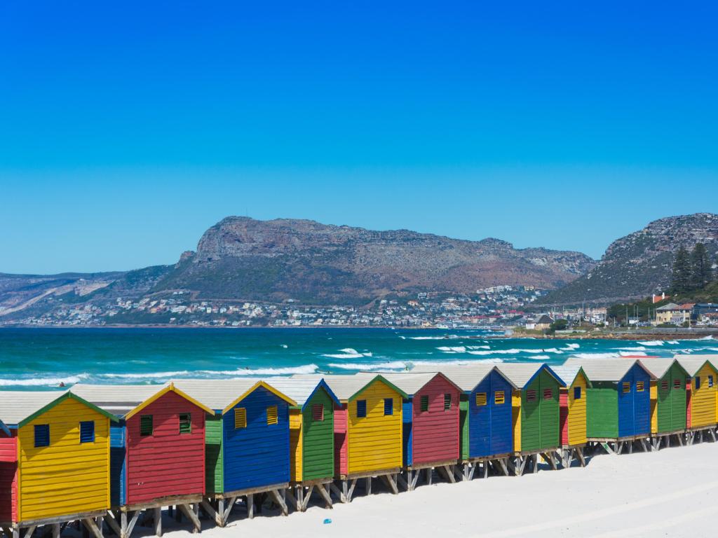Colorful wooden beach huts on the beach at Muizenberg, Cape Town