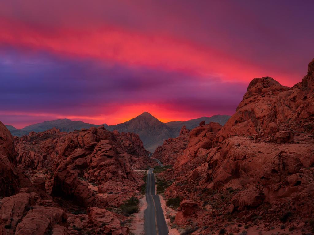 Valley of Fire State Park, Nevada, USA with an aerial panoramic view on the scenic road in the desert during a cloudy twilight. 