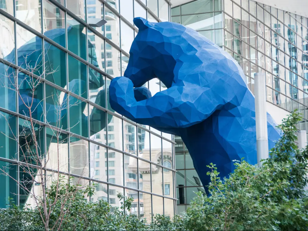The 40-foot-high Blue Bear "I see what you mean" sculpture imparts a sense of fun and playfulness as it peers into Denver's downtown convention center.