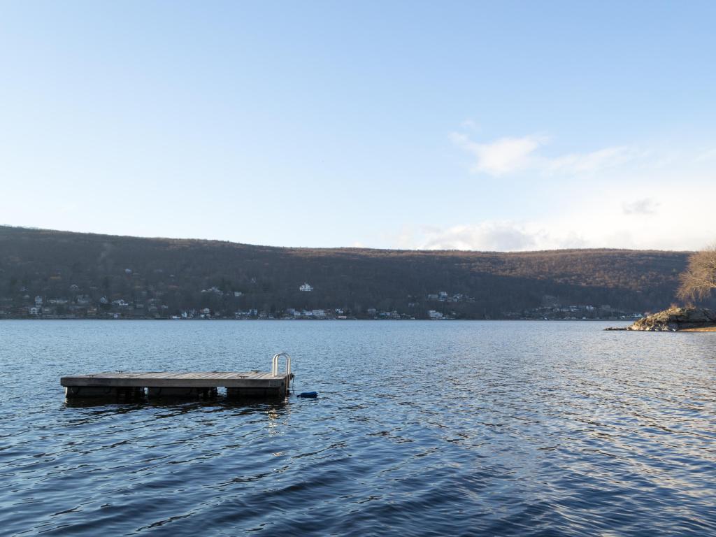 View across expansive Greenwood Lake, with swimming platform in the waters