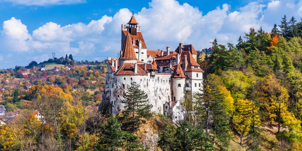 Bran Castle in Romania surrounded by trees 