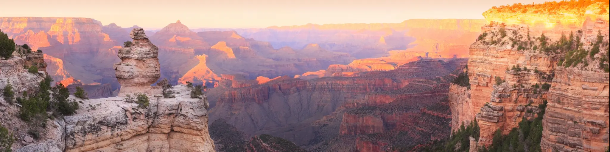 Panorama of the Grand Canyon with Sunset Colors Reflecting in the Rocks