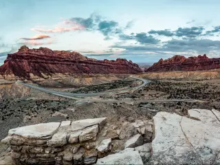 Driving in the desert down the highway through Spotted Wolf Canyon View in Utah, USA
