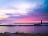 Beautiful sunset over the lighthouse in Muskegon Michigan at the beach