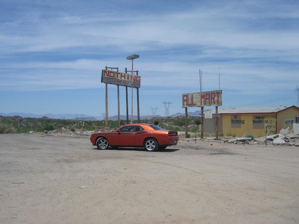 Dodge Challenger R/T parked in the town of Nothing, Arizona in the middle of the desert.