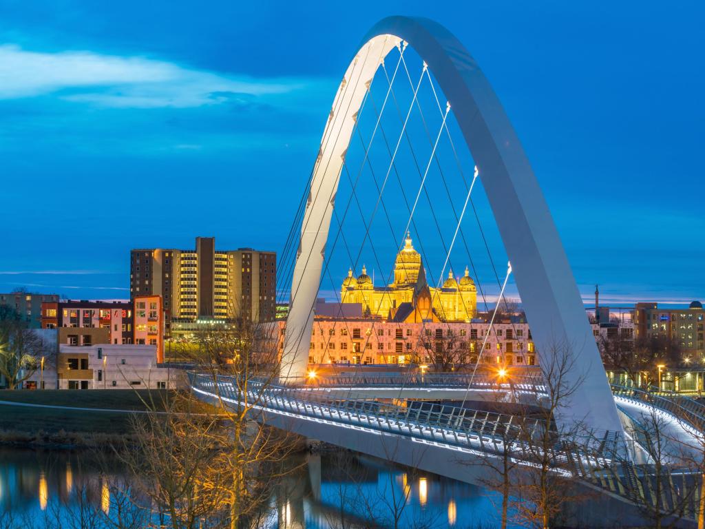 Des Moines, Iowa, USA taken at the State Capitol with the arch in the foreground and taken at night.