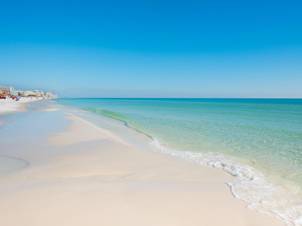 Emerald coast, Florida, USA with the stunning coastline with blue sky and blue green water on a sunny day.