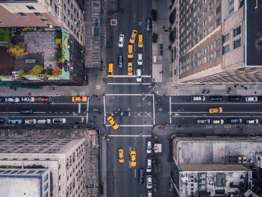 New York City road viewed from above, with yellow taxis lined up