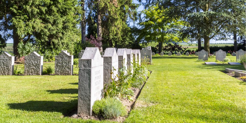 German graves at Saint-Symphorien Cemetery surrounded by grass and trees