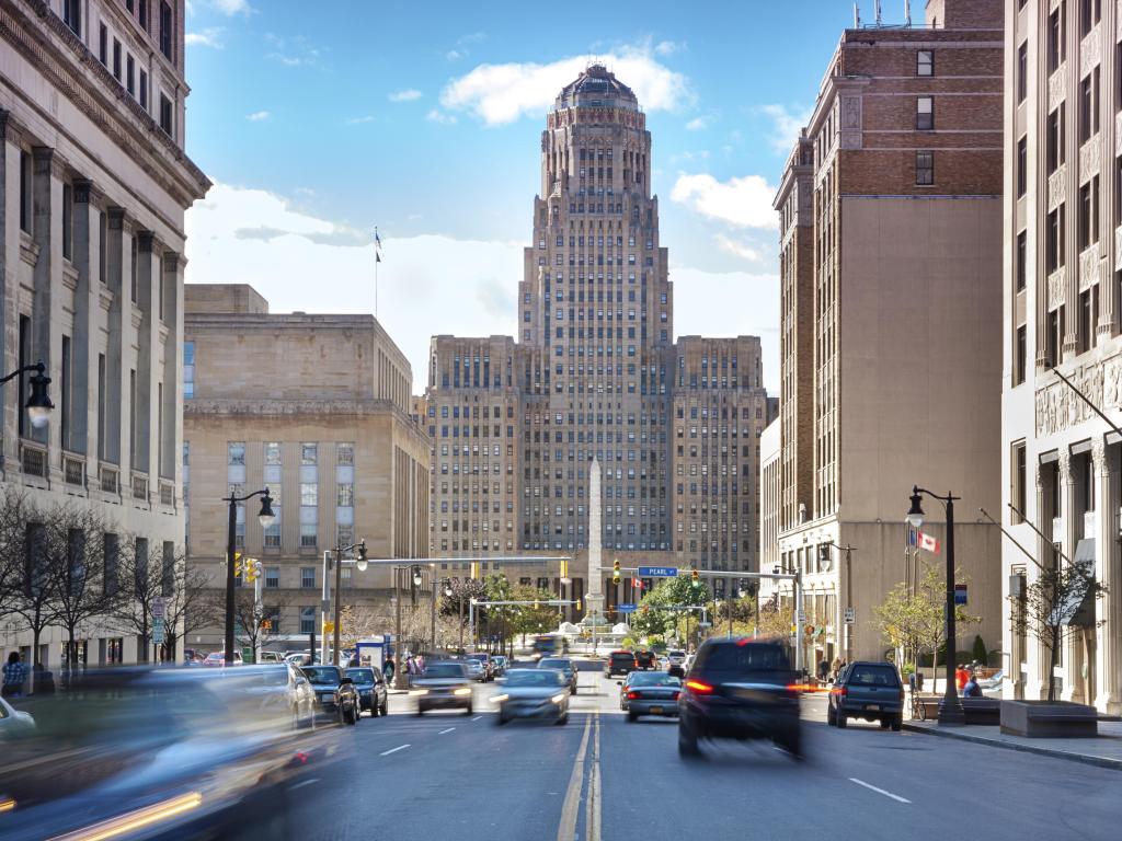 Buffalo, New York, USA a typical busy street in the city with buildings in the distance and cars in the road.