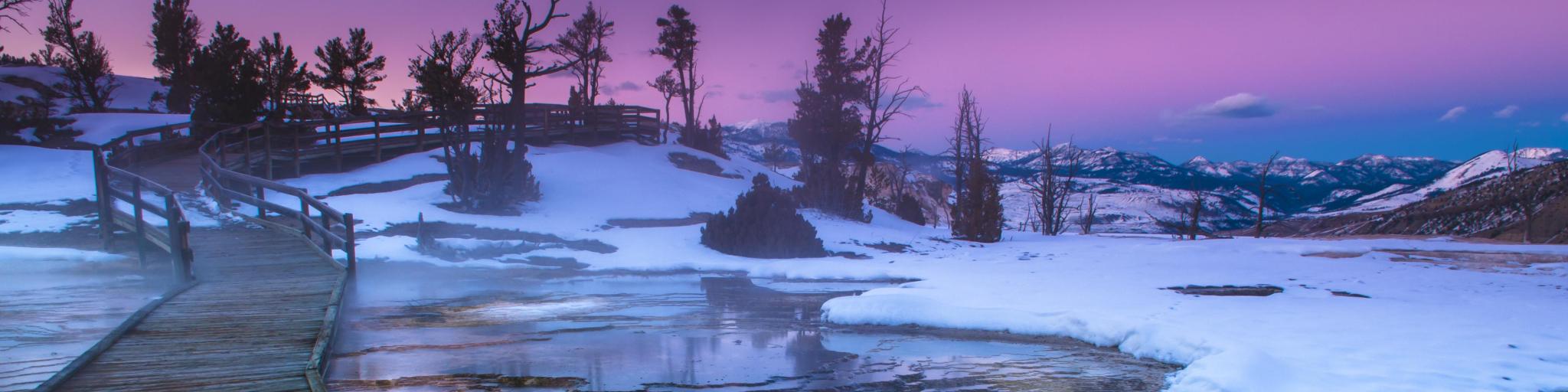 Yellowstone National Park, Wyoming, USA with a beautiful cold winter sunset.