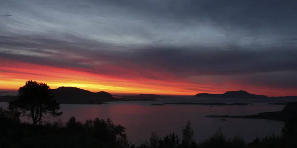 The fiery red sunset in Alesund as seen from Fjellstua viewpoint
