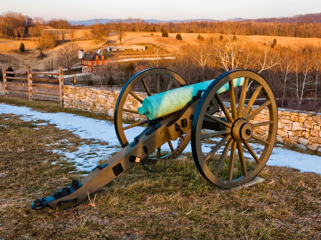 Evening light on a cannon and battlefields in Antietam National Battlefield, Maryland.